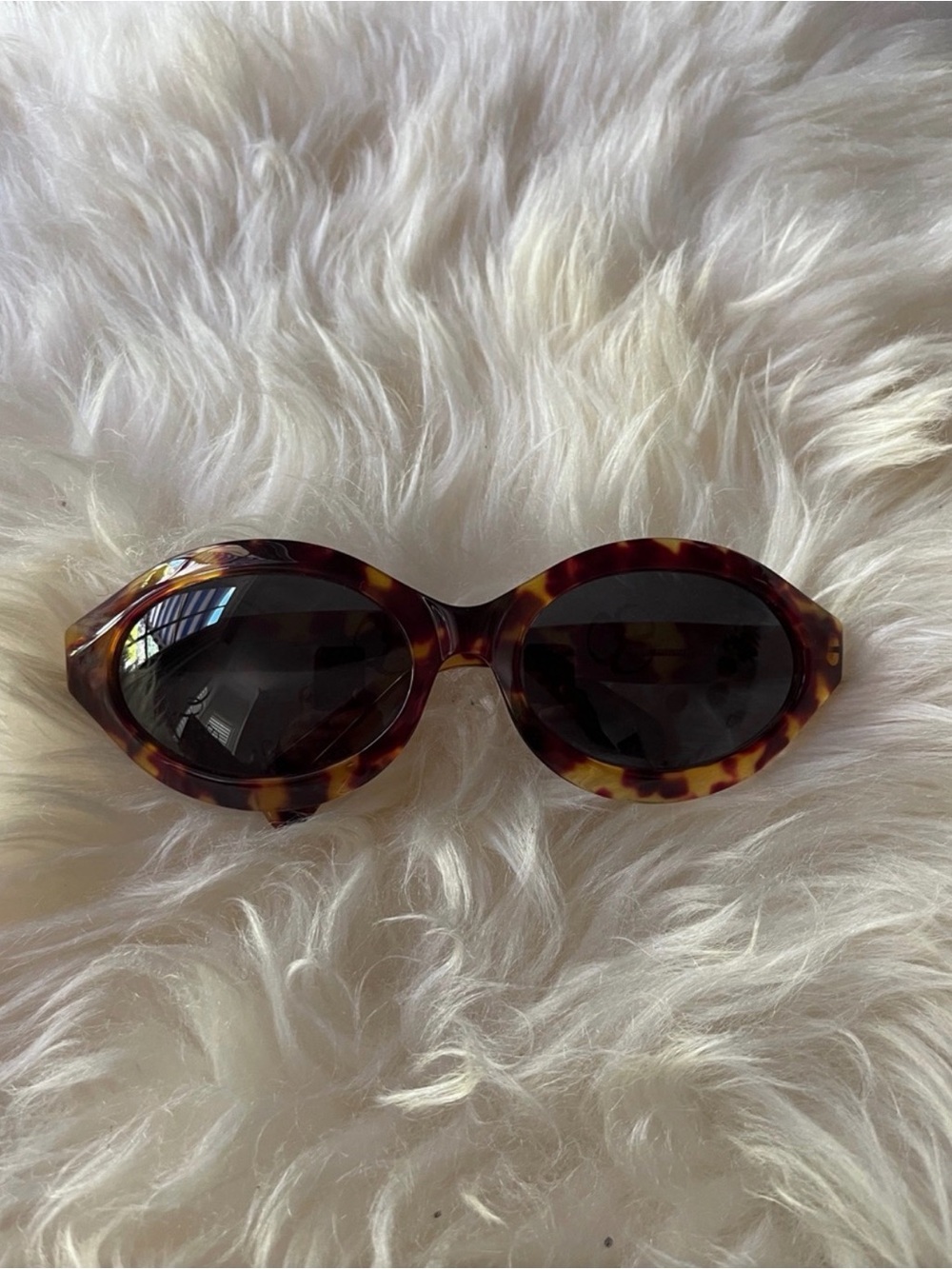 Gucci Tortoiseshell Oval Sunglasses with Dark Lenses
